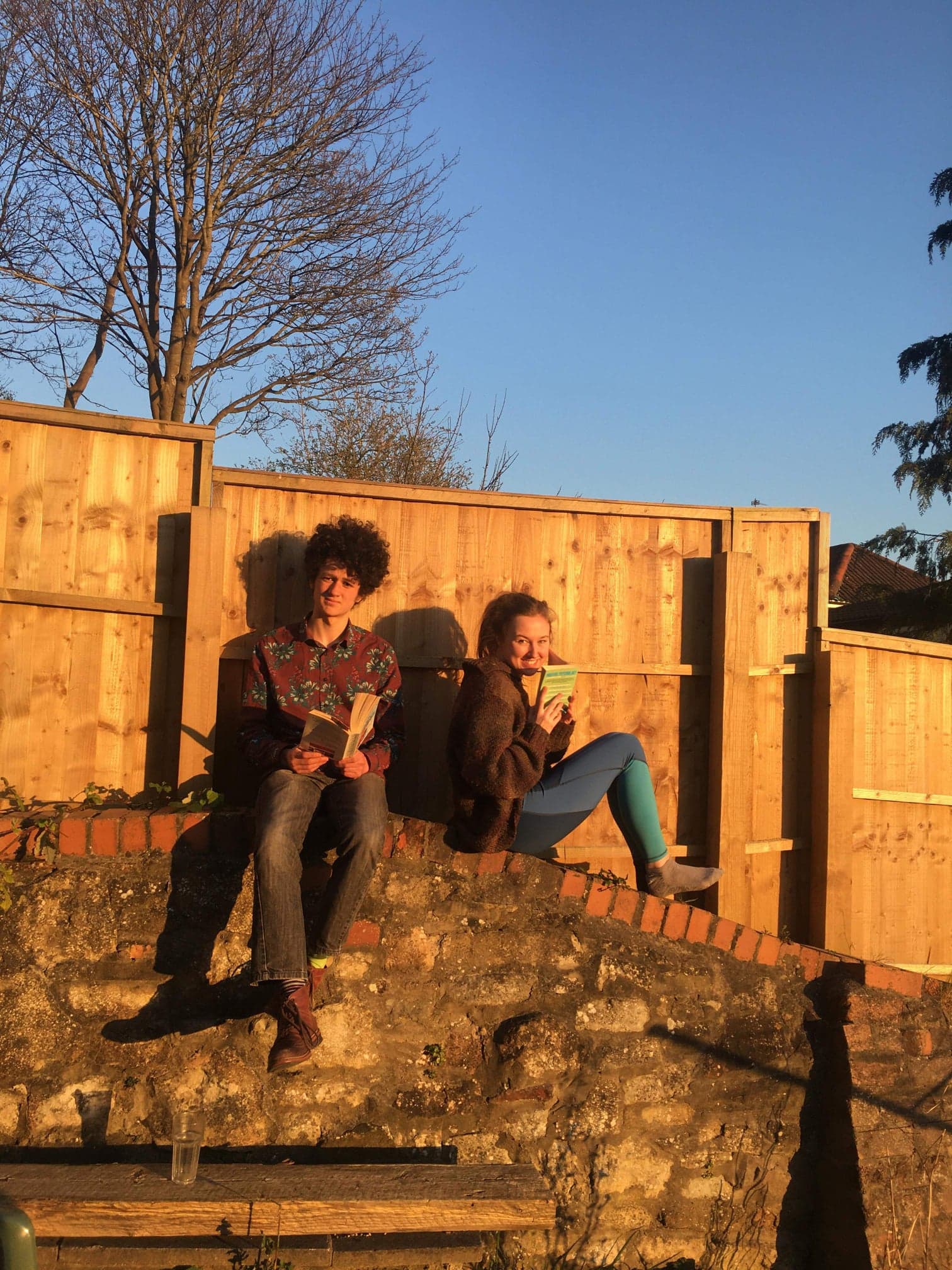my fiancee and I reading in the garden